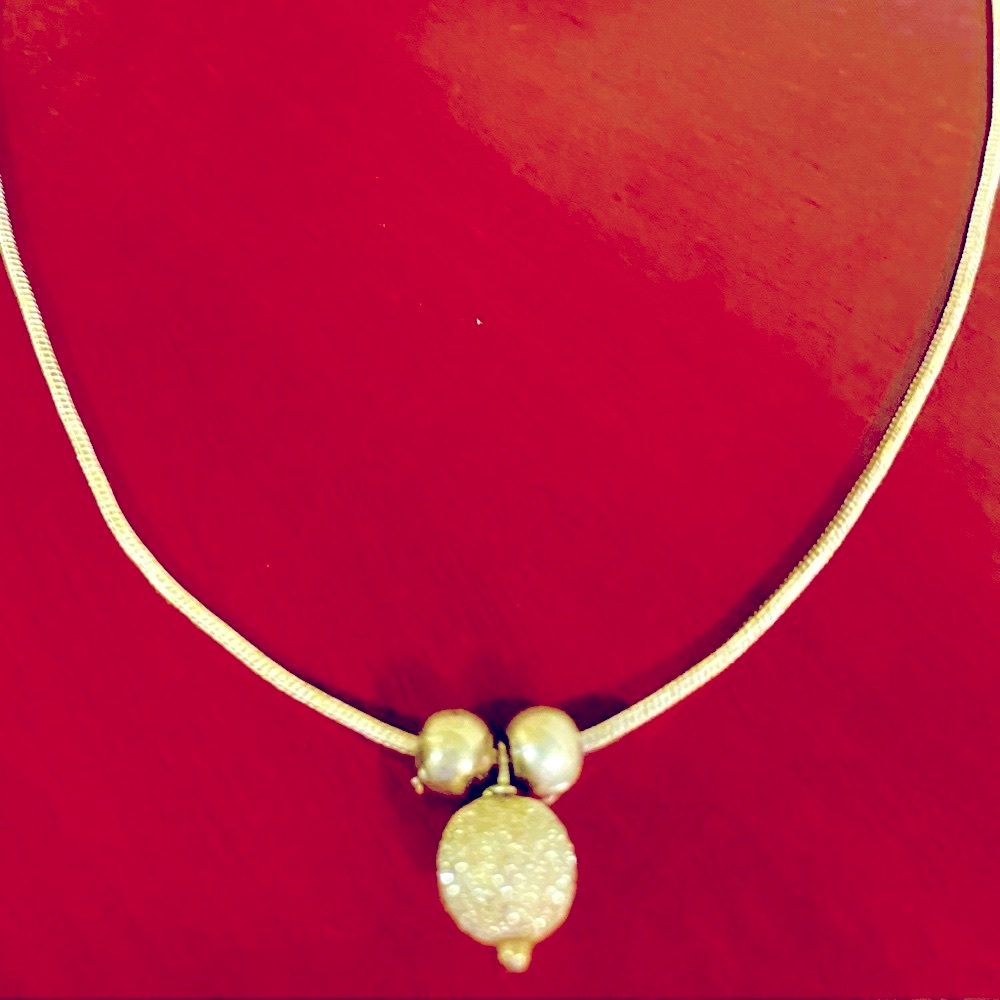Sterling silver includes two small round slides with medium cz slide